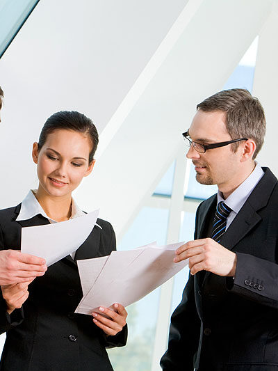 Portrait of busy people discussing new project or working plan